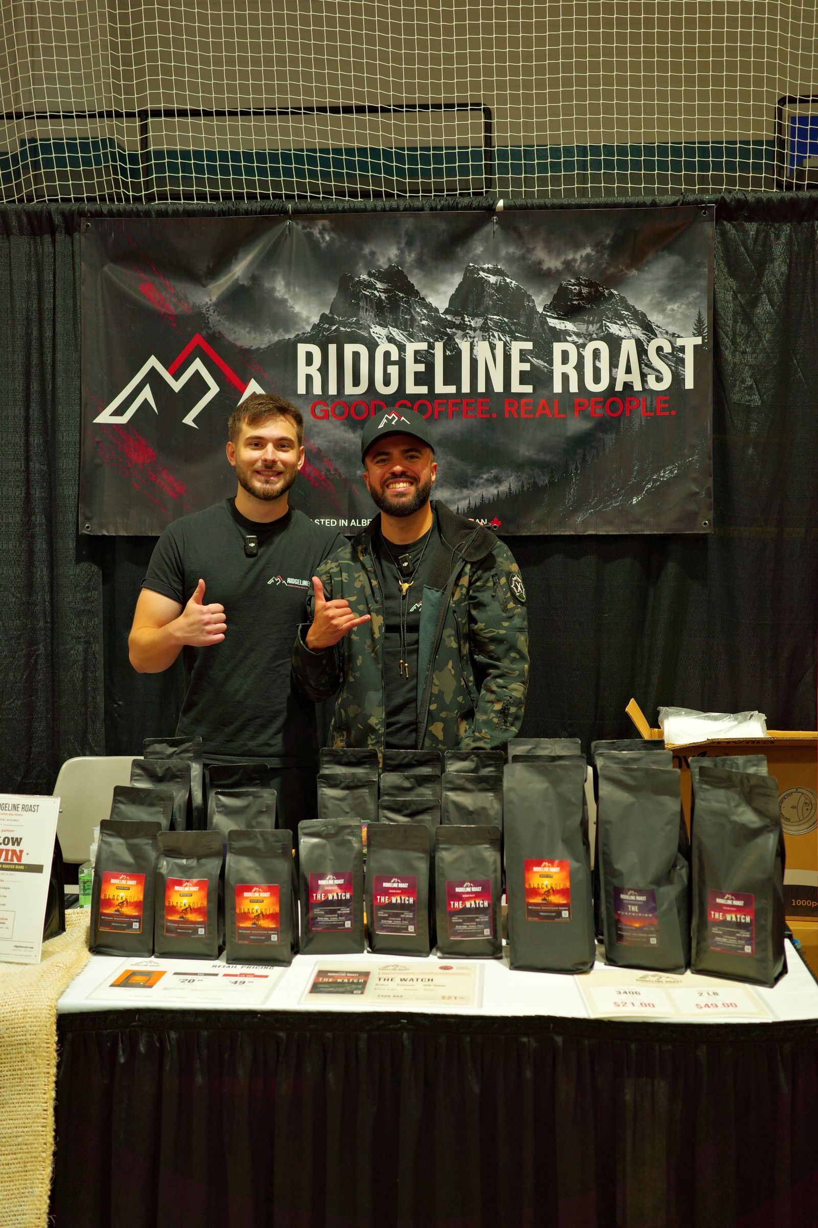 Two people at the Ridgeline Roast market booth