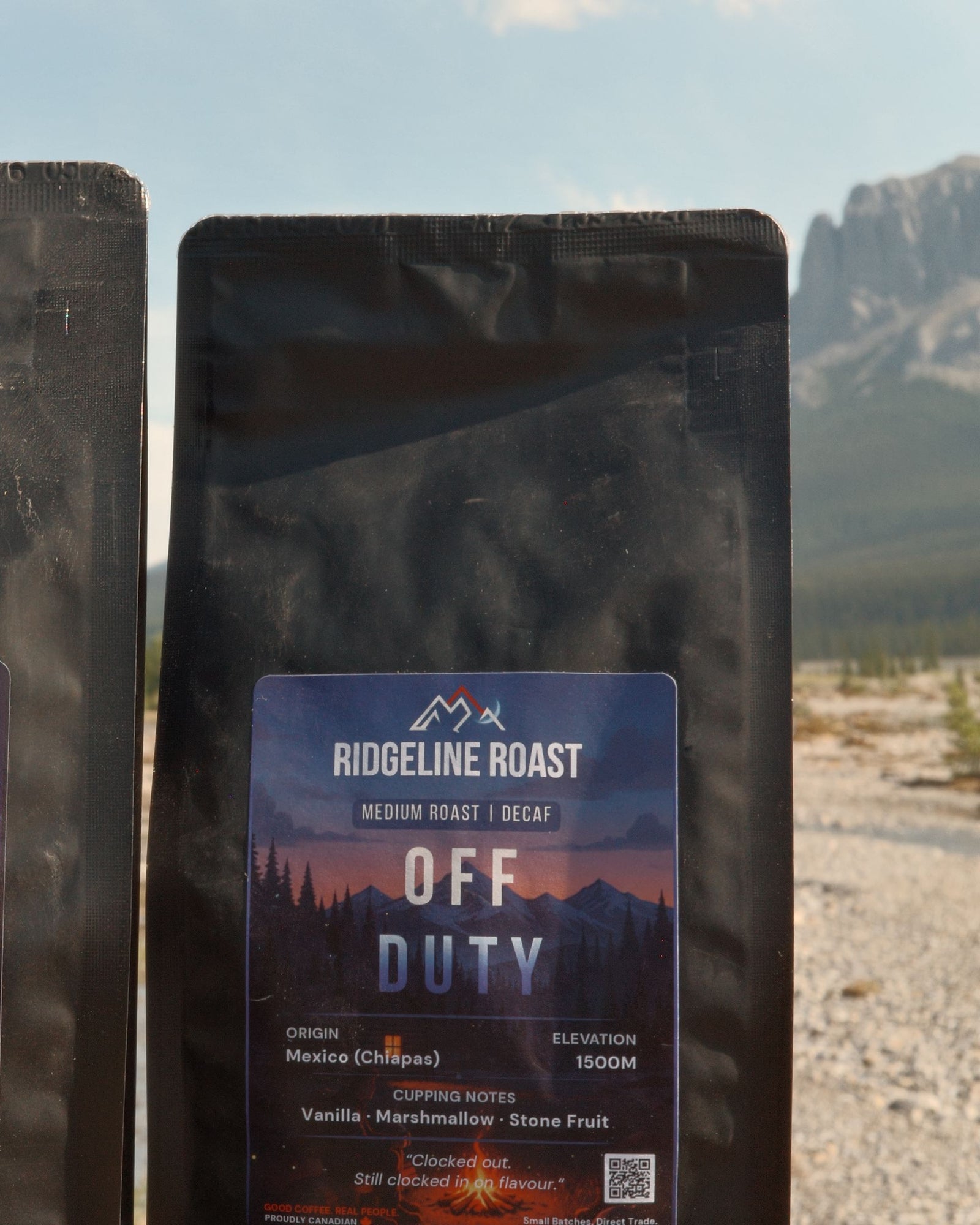 A bag of Off Duty on a truck tailgate in the mountains