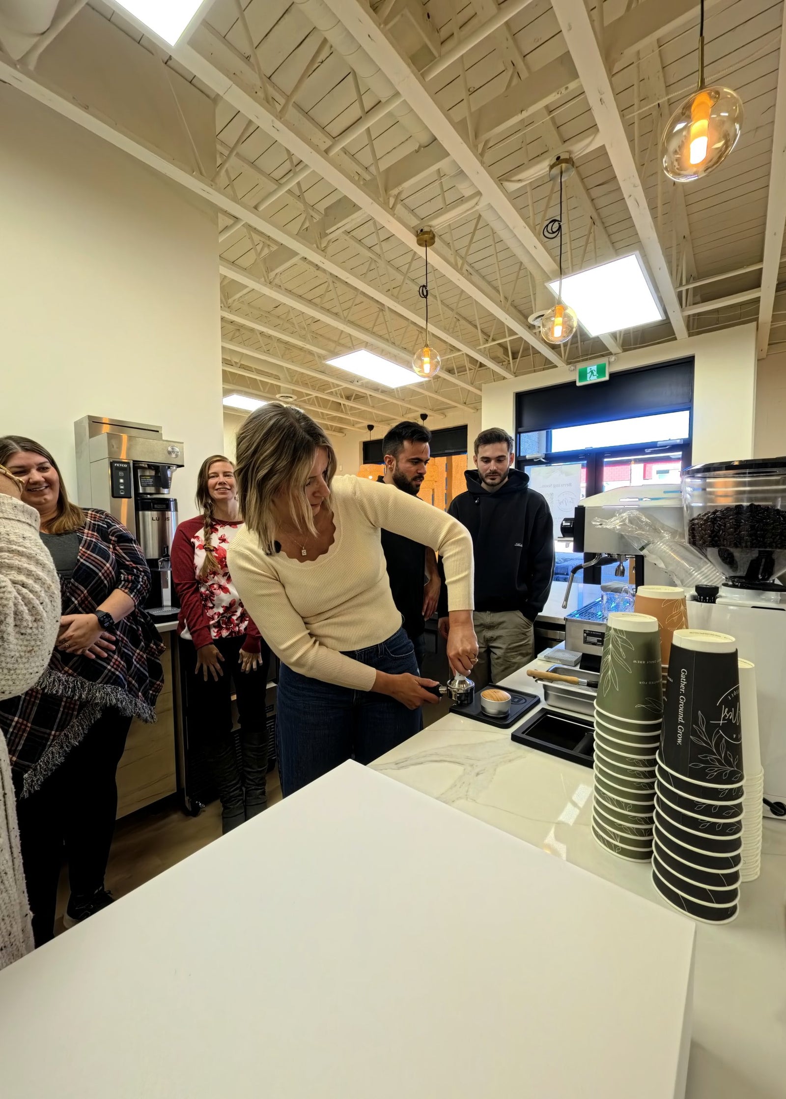 Barista training at the espresso machine at Nest Cafe