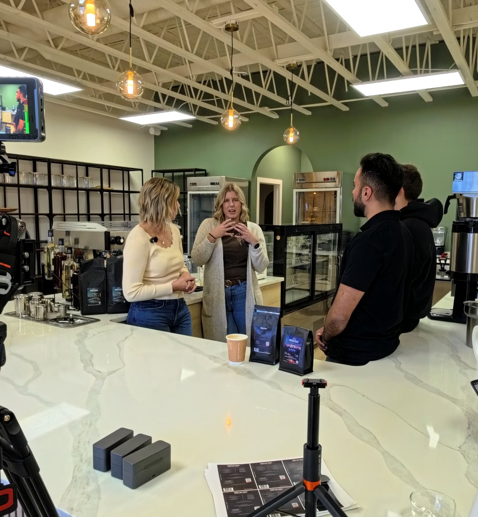 Talking coffee with the Nest Cafe team at the counter