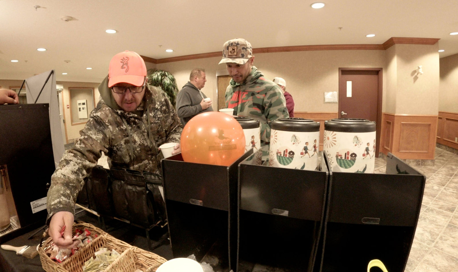 Hunters getting coffee at the Ridgeline table at the Stettler Pheasant Fest