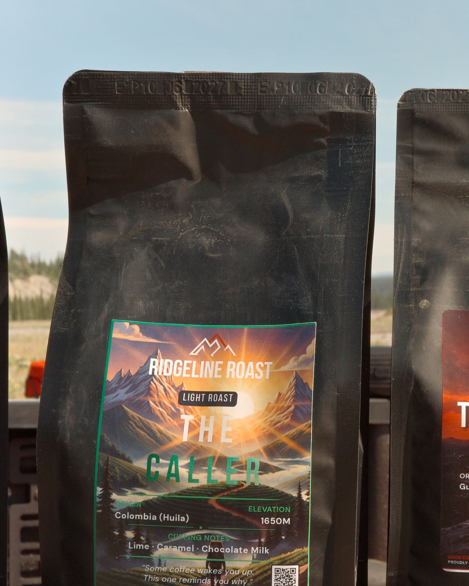 A bag of The Caller on a truck tailgate in the mountains